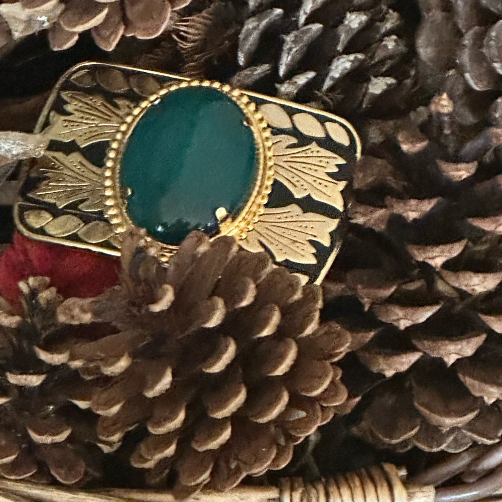Western Belt Buckle Gold and Black With Green Stone. Measures 3”x 2 3/4”.